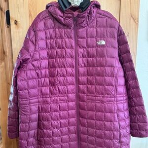 Women’s The North Face maroon colored jacket.